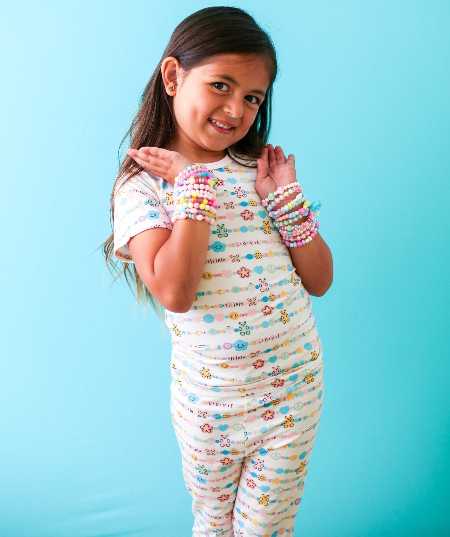 Short sleeve baby pajama set with Let's Be Friends print, matching top and pants in pink tones