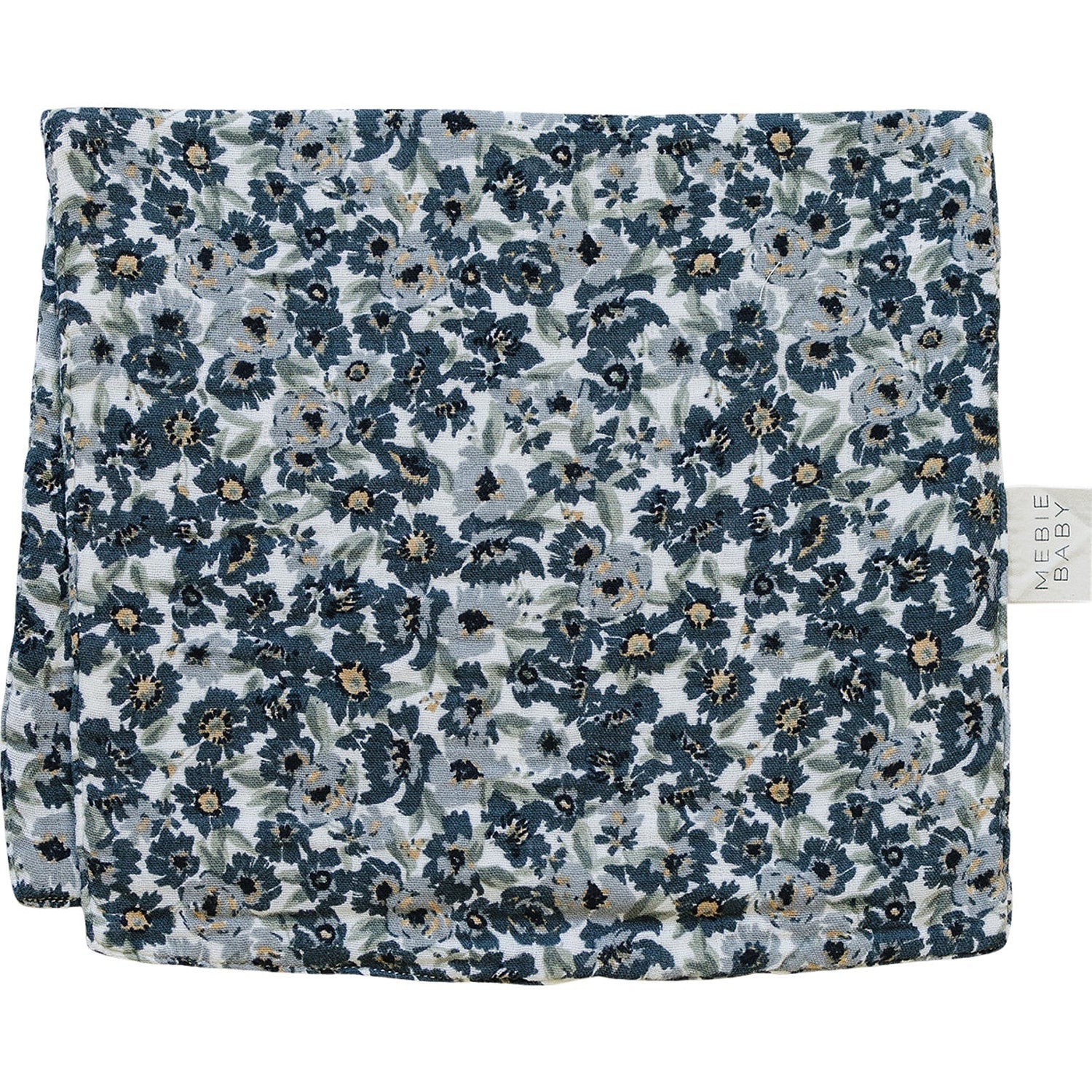Muslin burp cloth in a small Liberty floral print, laid flat to show the rectangular shape.