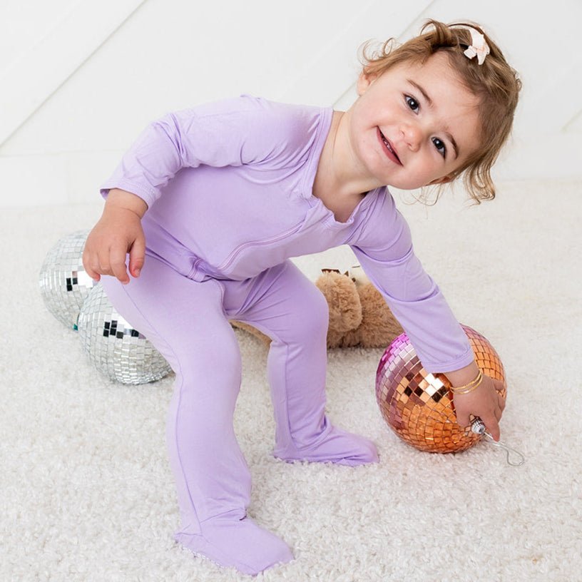 Lilac purple baby footie with fold-over mittens and a full-length front zipper.