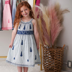 Baby dress in cream and sage with ethnic embroidery, lace hem, ombre effect, and a round stretchy neckline.