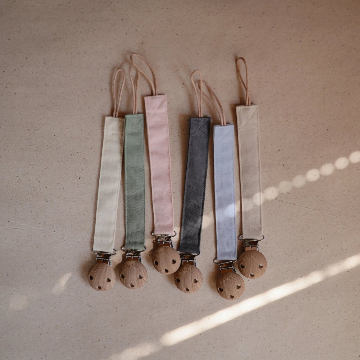 Mushie Linen Pacifier Clip Two Pack with Water Resistant Coating and Faux Wood Silicone Clasp - 