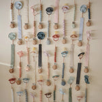 Mushie Linen Pacifier Clip Two Pack with Water Resistant Coating and Faux Wood Silicone Clasp - 