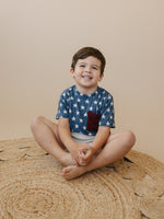 Little Joy Co bamboo pocket tee in a neutral color, showcasing its soft viscose fabric and front pocket.