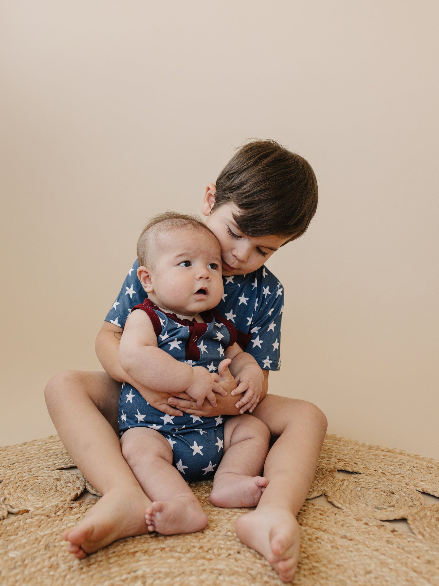 Little Joy Co bamboo pocket tee in a neutral color, showcasing its soft viscose fabric and front pocket.