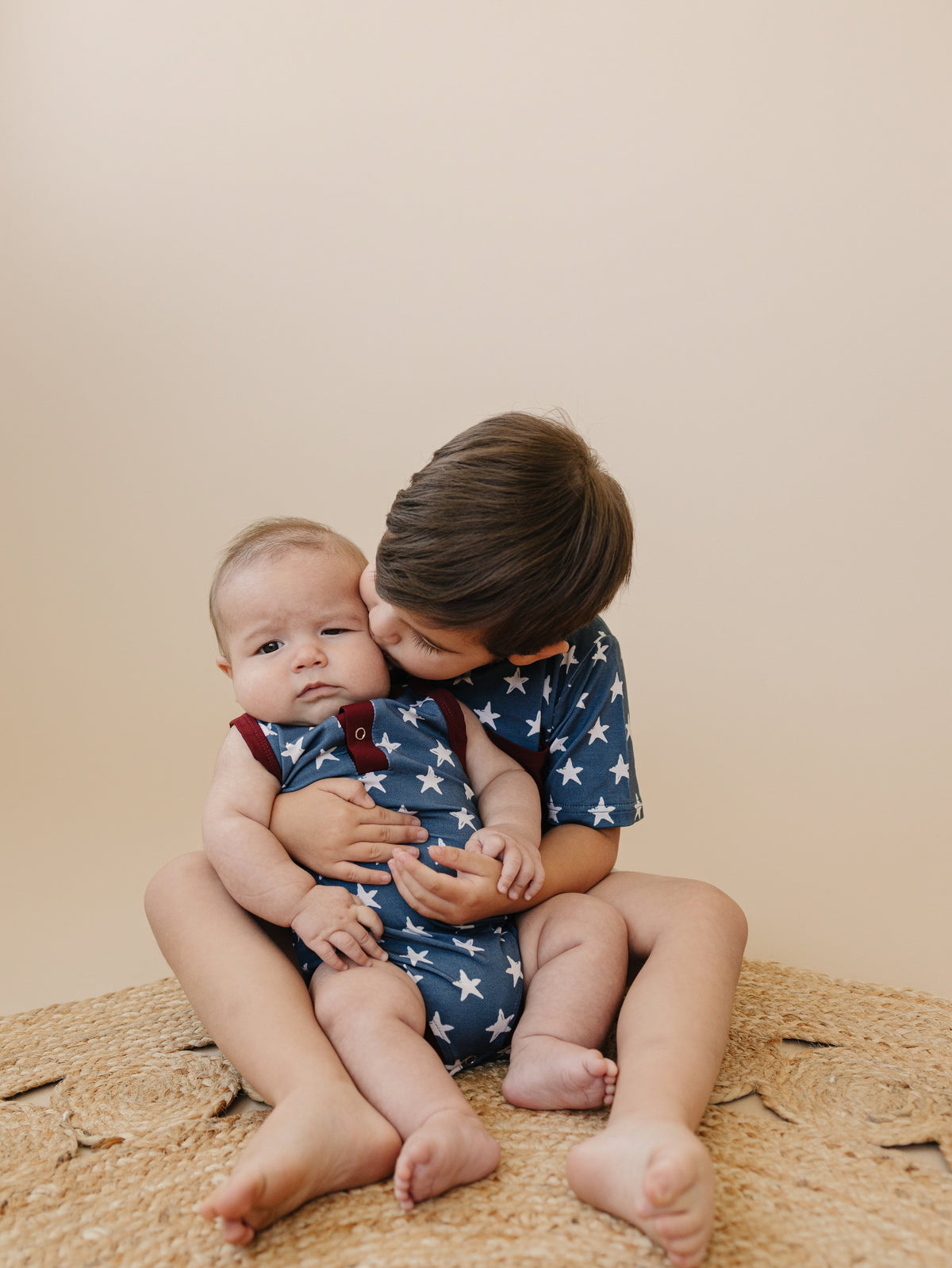 Little Joy Co bamboo pocket tee in a neutral color, showcasing its soft viscose fabric and front pocket.