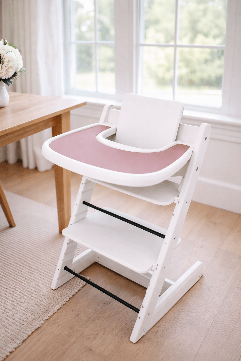 Little Joy Co. BPA-free silicone placemat on a Stokke Tripp Trapp highchair tray, ready for feeding.