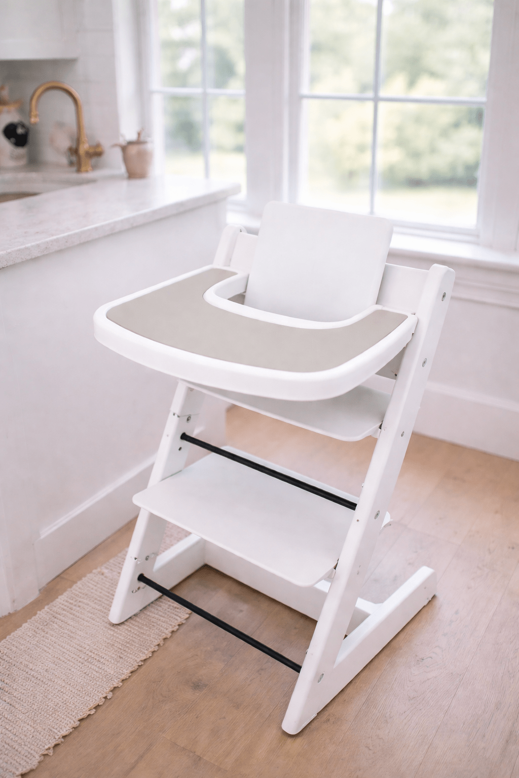Little Joy Co. BPA-free silicone placemat on a Stokke Tripp Trapp highchair tray, ready for feeding.