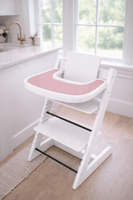 Little Joy Co. BPA-free silicone placemat on a Stokke Tripp Trapp highchair tray, ready for feeding.