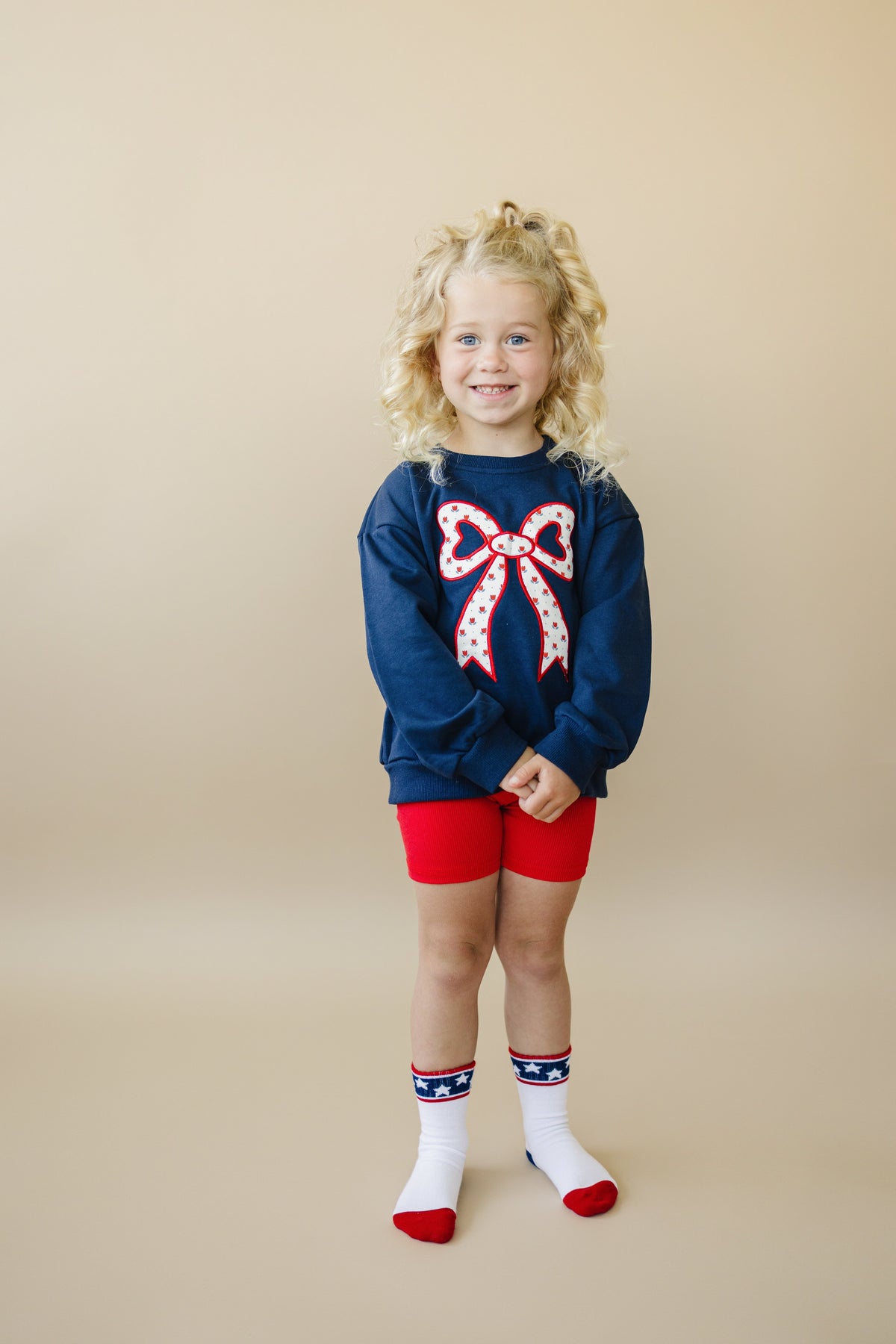 Little Joy Co. Little Joy Co. Tulip Print Sweatshirt with Bow Applique