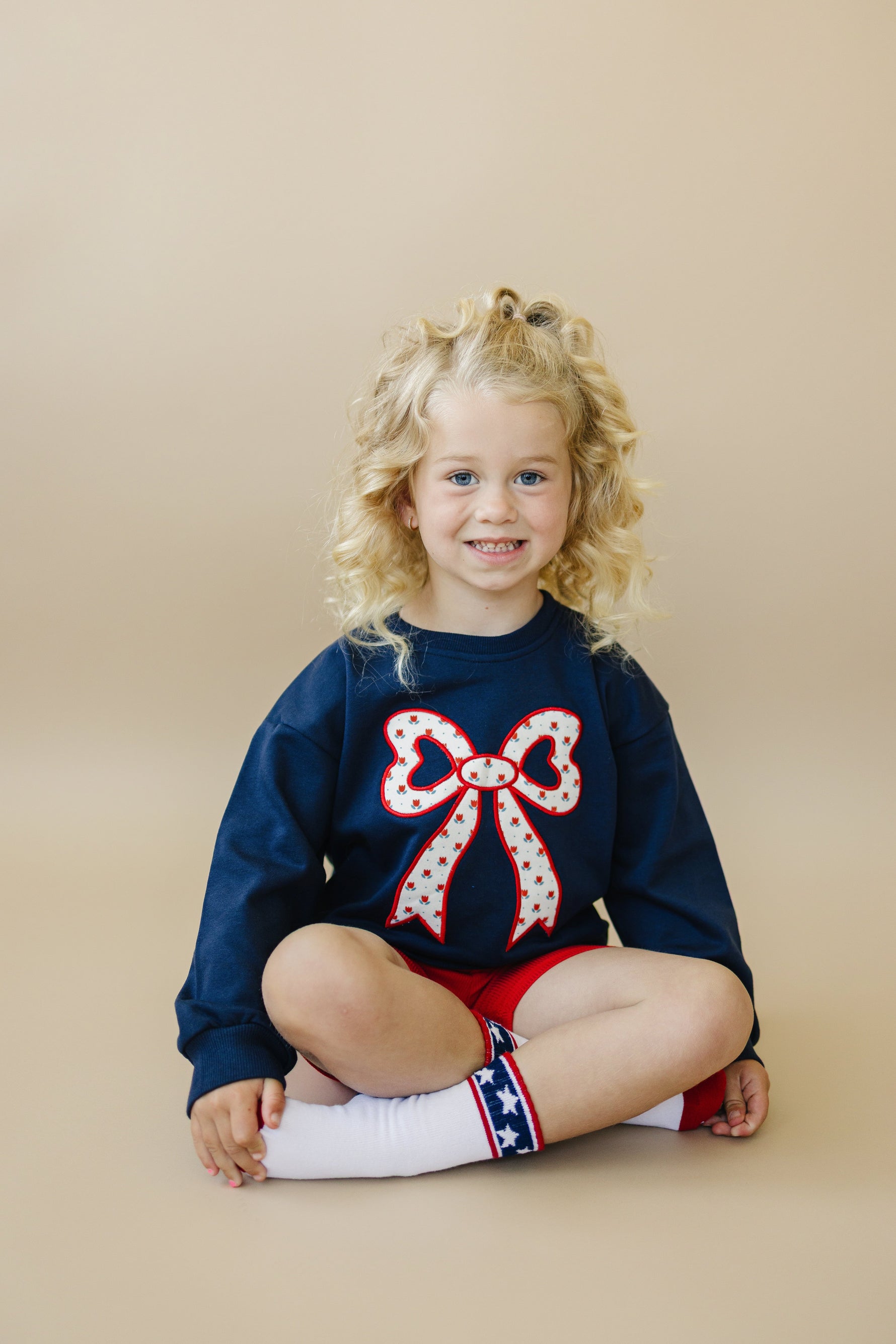 Little Joy Co. Little Joy Co. Tulip Print Sweatshirt with Bow Applique