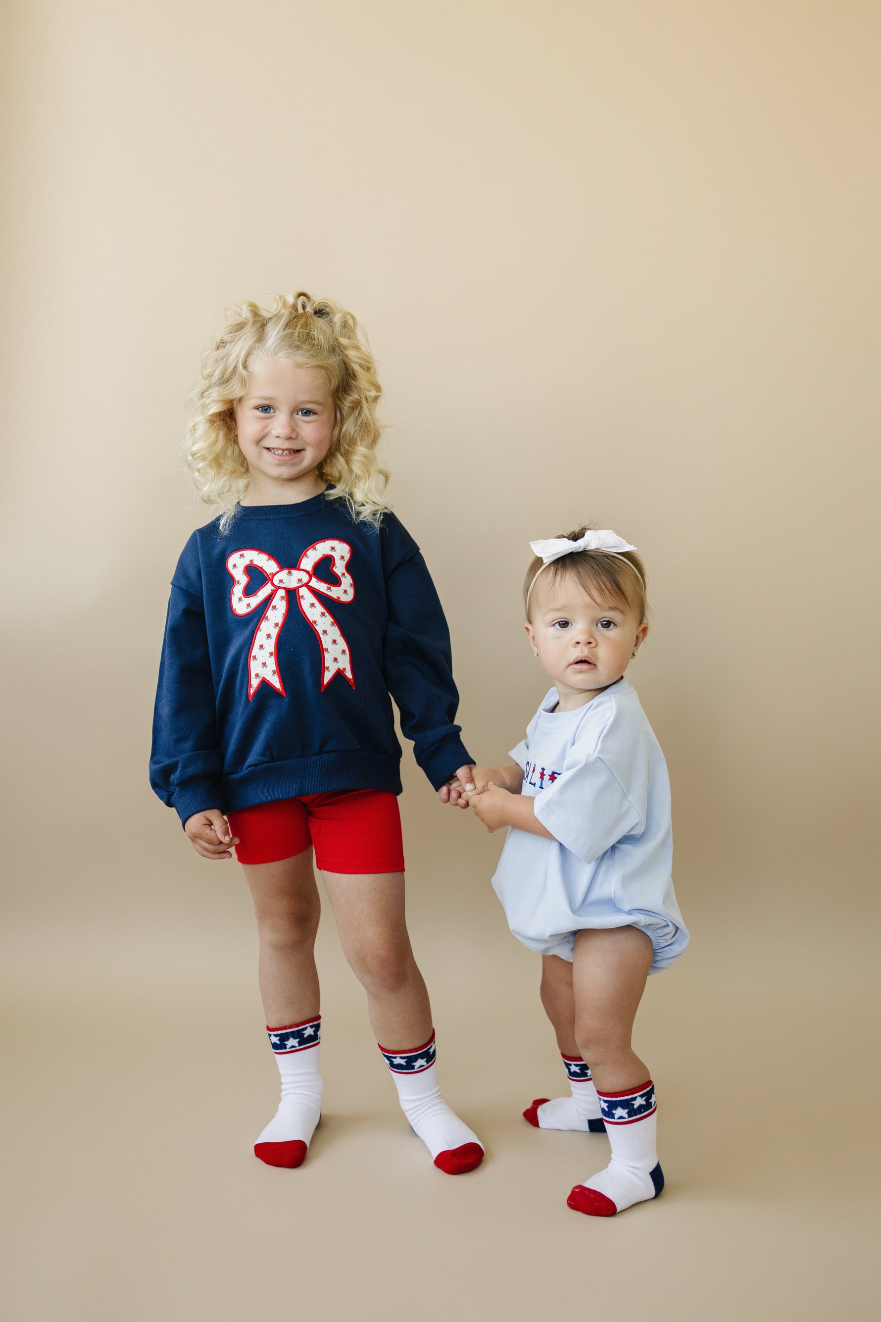 Little Joy Co. Little Joy Co. Tulip Print Sweatshirt with Bow Applique