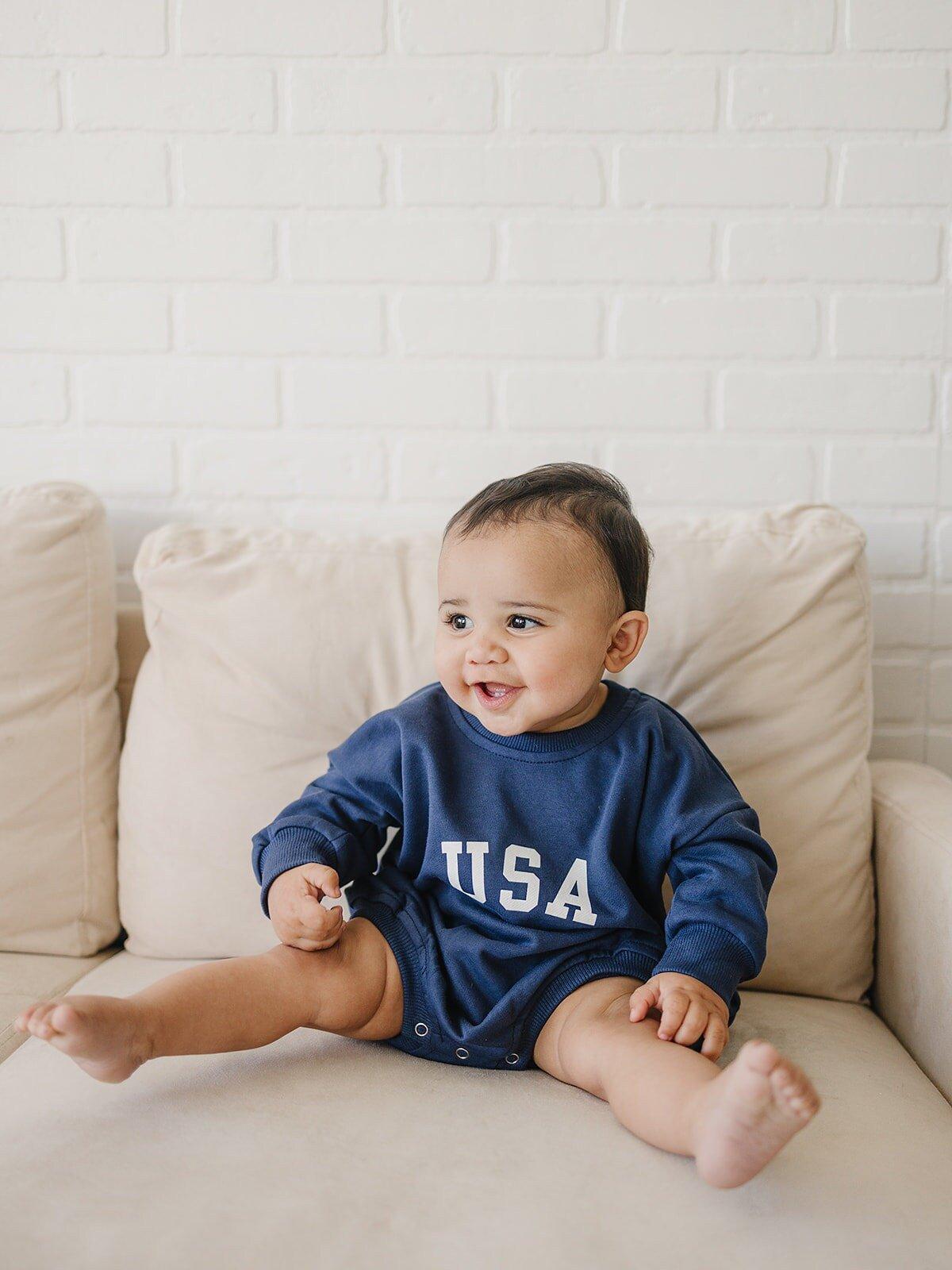 Little Joy Co. USA ultra-soft terry sweatshirt romper for babies.