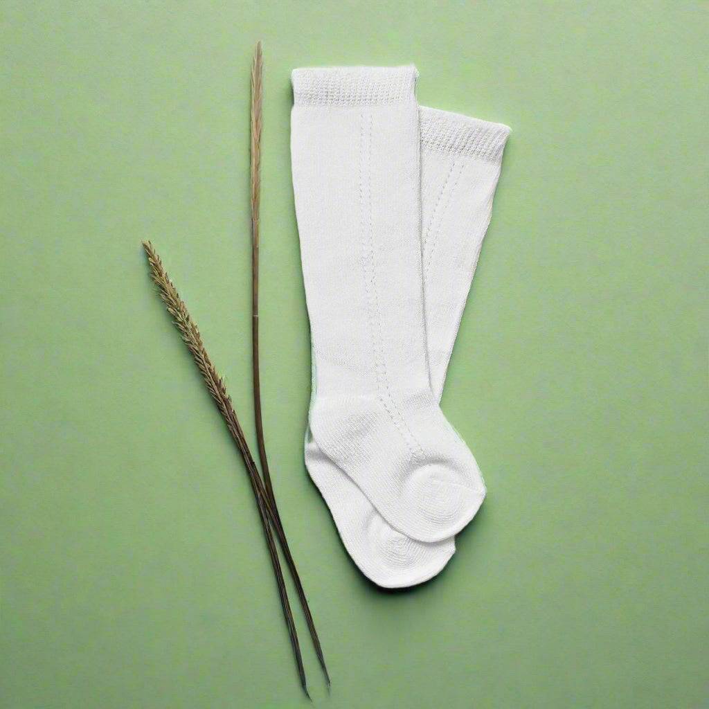 Soft, breathable Little Love Bug Co. LLB eyelet knee high socks, 2 pairs.