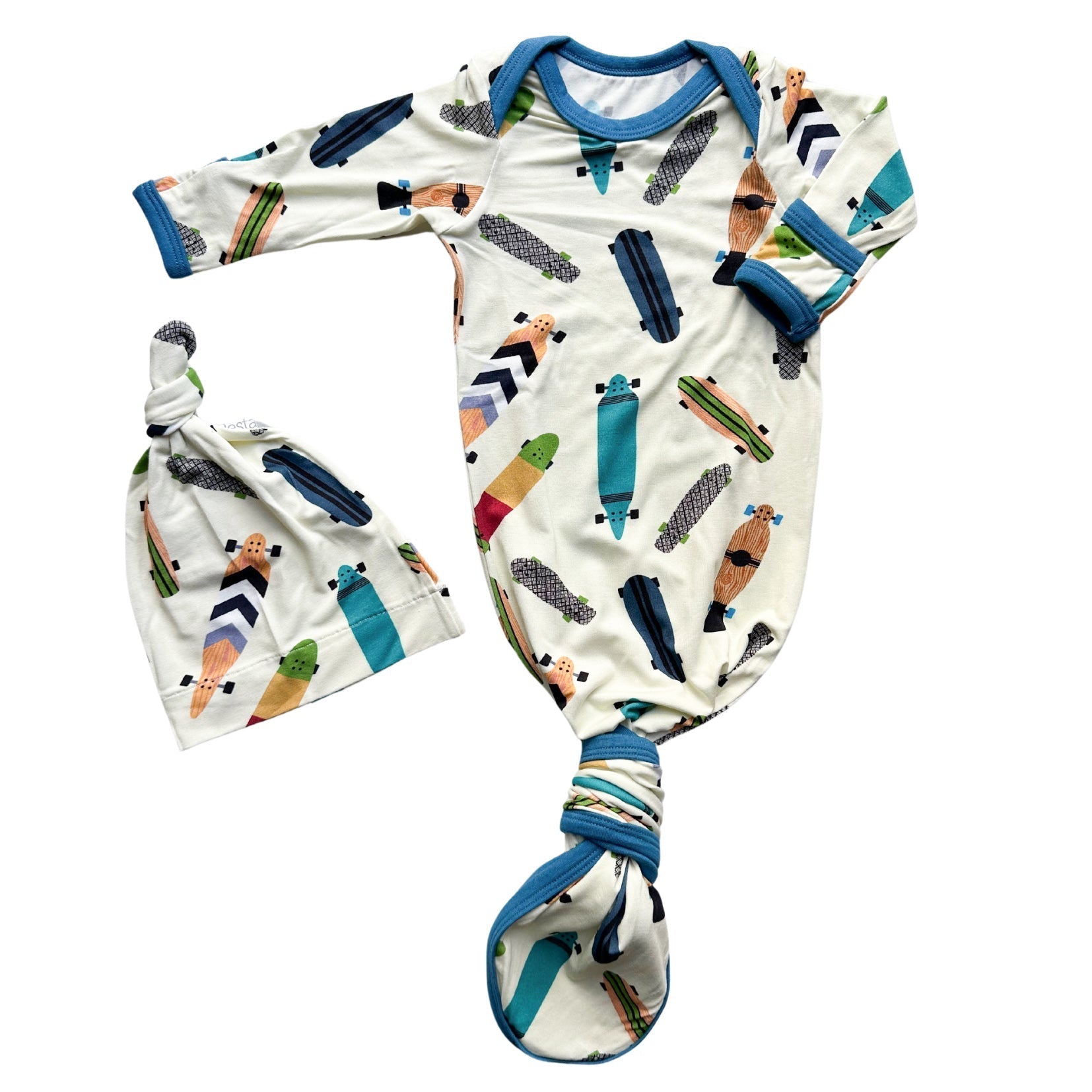 Baby gown with longboard print and fold-over mittens, shown with a matching hat.