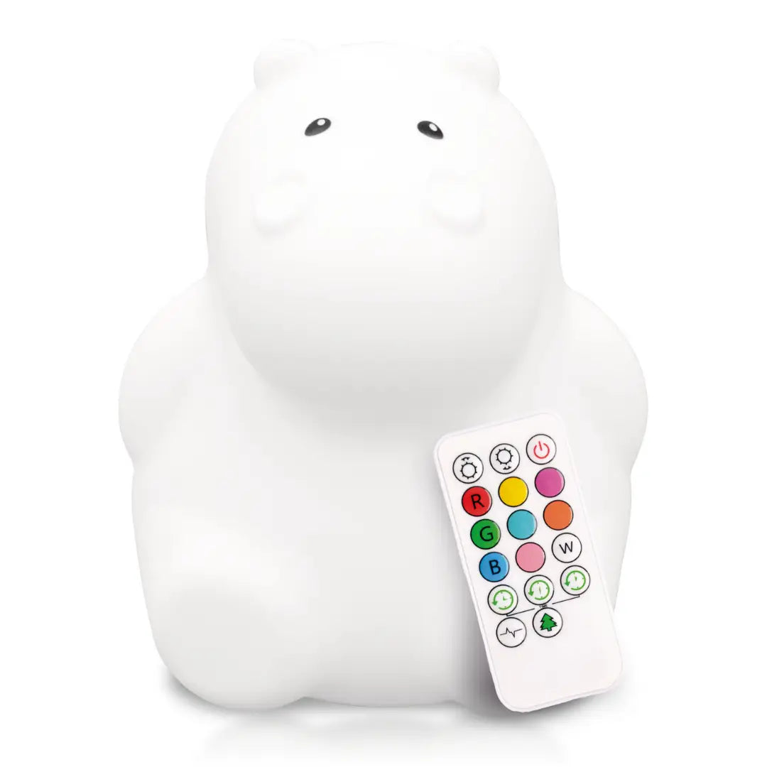 Hippo-shaped silicone children's night light glowing in a warm color