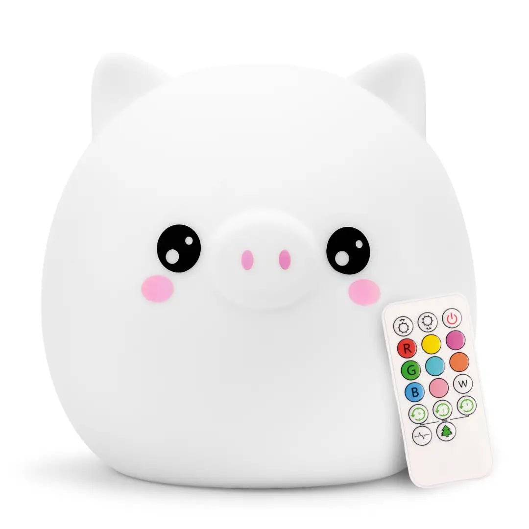 Pig-shaped silicone night light glowing in a soft color, with a friendly smiling face and curly tail.