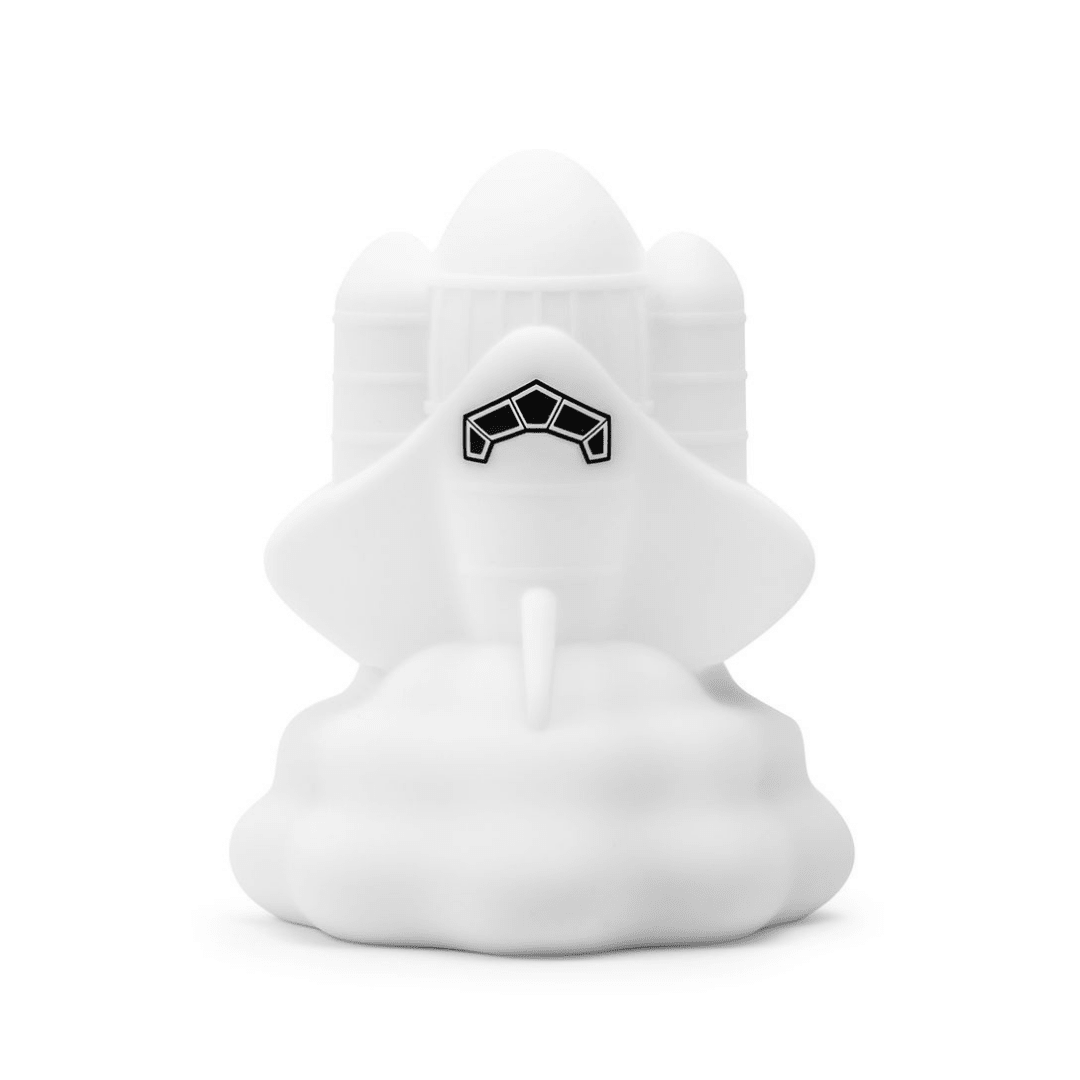 Rocket-shaped silicone night light glowing in a soft color, with a grumpy cartoon face.