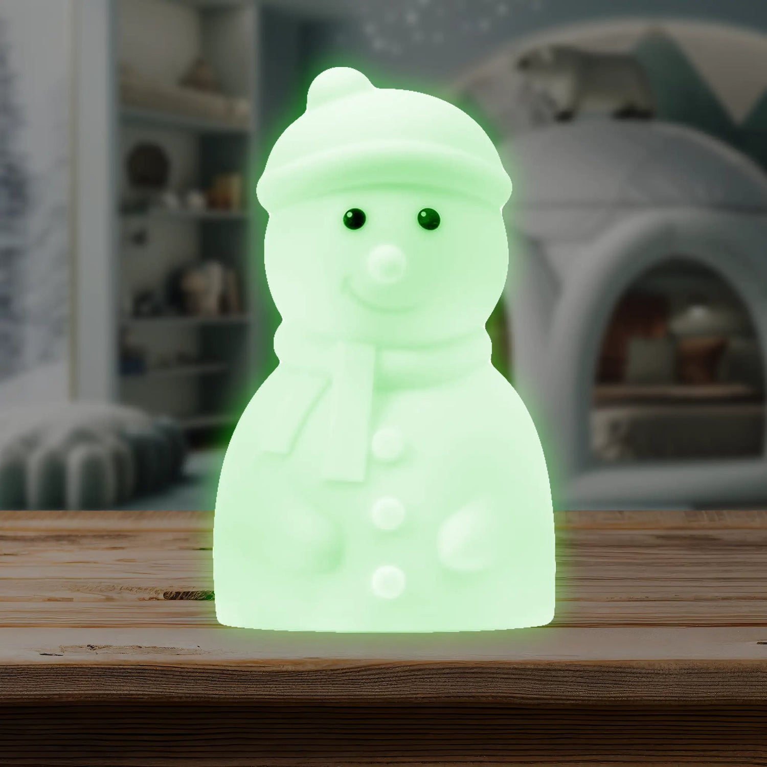 Snowman-shaped silicone LED night light glowing in a colorful hue with a friendly smiling face
