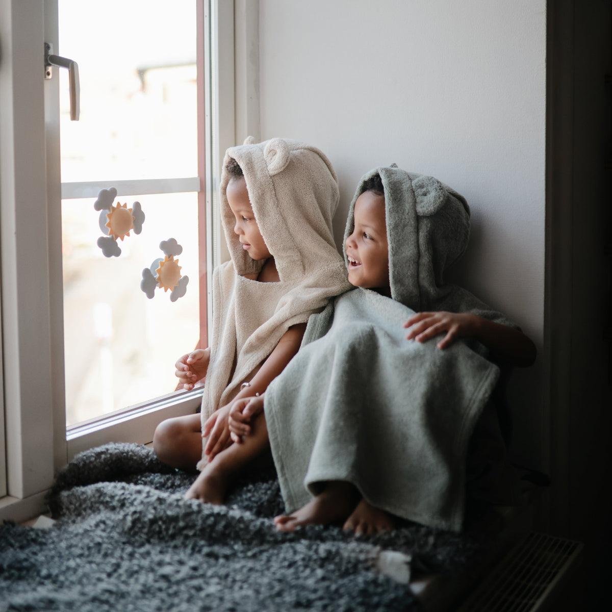 Mushie organic baby bear poncho towel for cozy bath time.