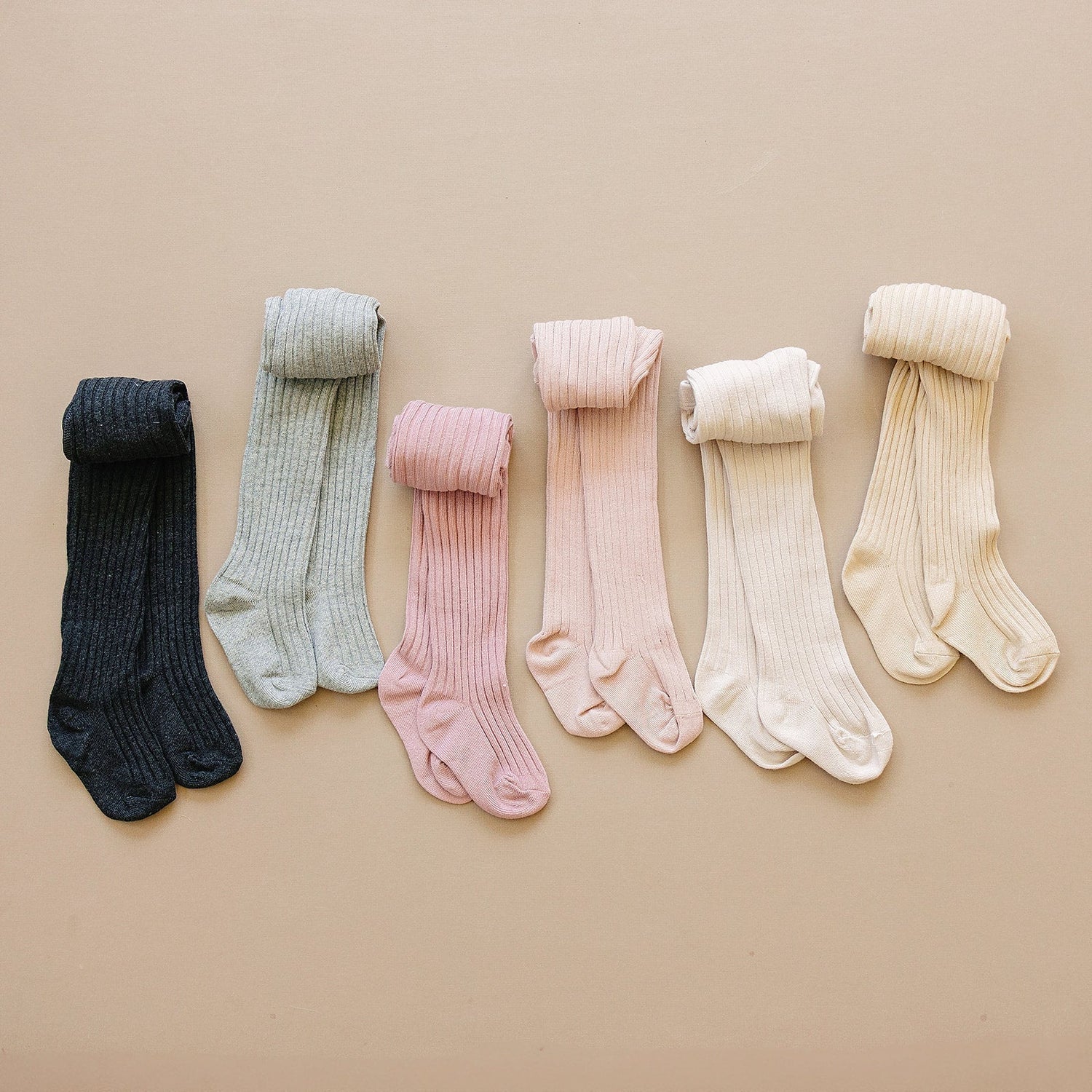 Ribbed baby tights shown flat, a snug stretchy style for babies and toddlers.