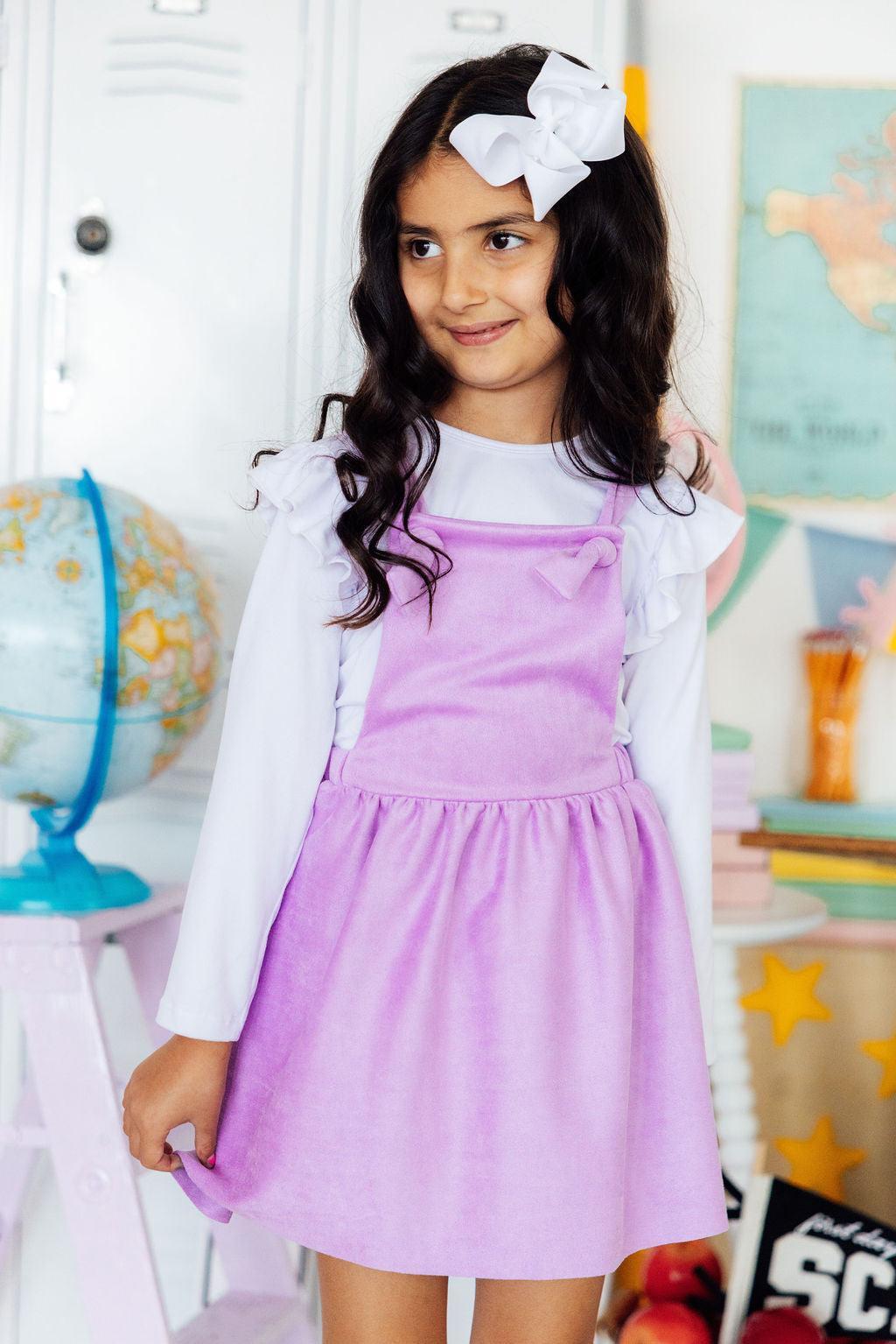 Lavender faux suede pinafore dress with crossback adjustable straps that criss-cross in the back