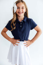 Navy S/S Ruffle Polo by Mila & Rose ®