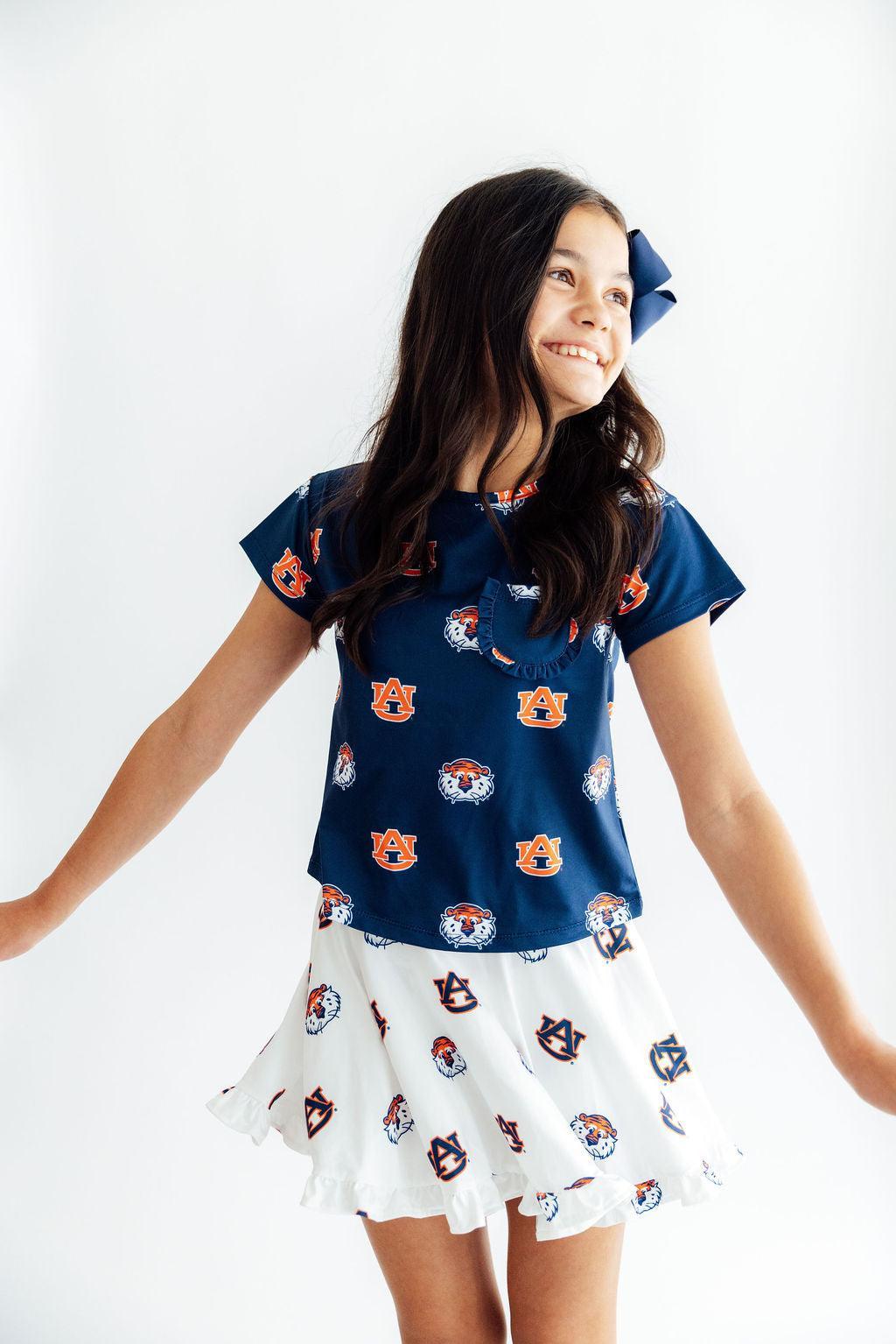 White Auburn ruffle twirl skort with team colors, ruffle detailing, and Aubie collegiate design