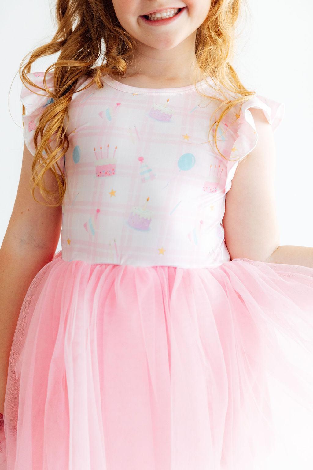 Flutter sleeve tutu dress for girls with a full twirl skirt, styled for birthday dress-up.