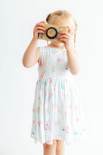 Malibu Girl sleeveless twirl dress with ballet neckline, scoop back, and a full skirt