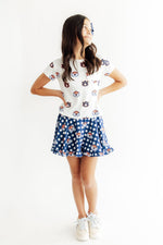 Auburn plaid ruffle twirl skort in orange and blue with tiered ruffle detail