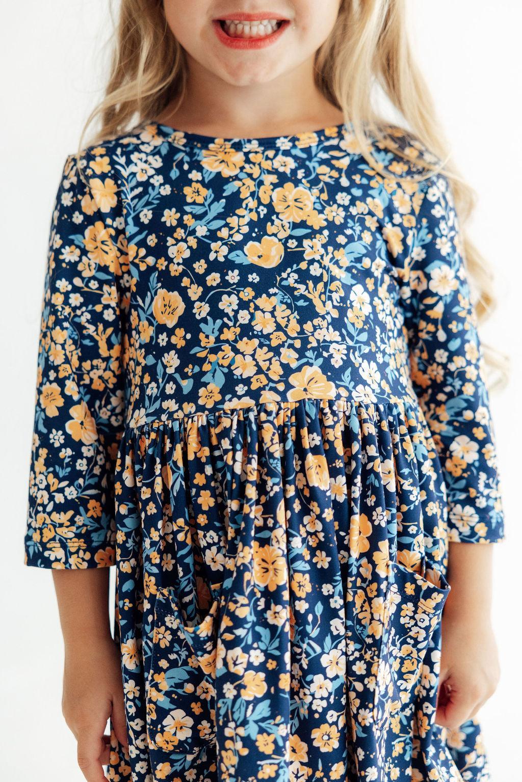 Marigold Moon twirl dress with 3/4 sleeves, pockets, ballet neckline, and a full twirl skirt