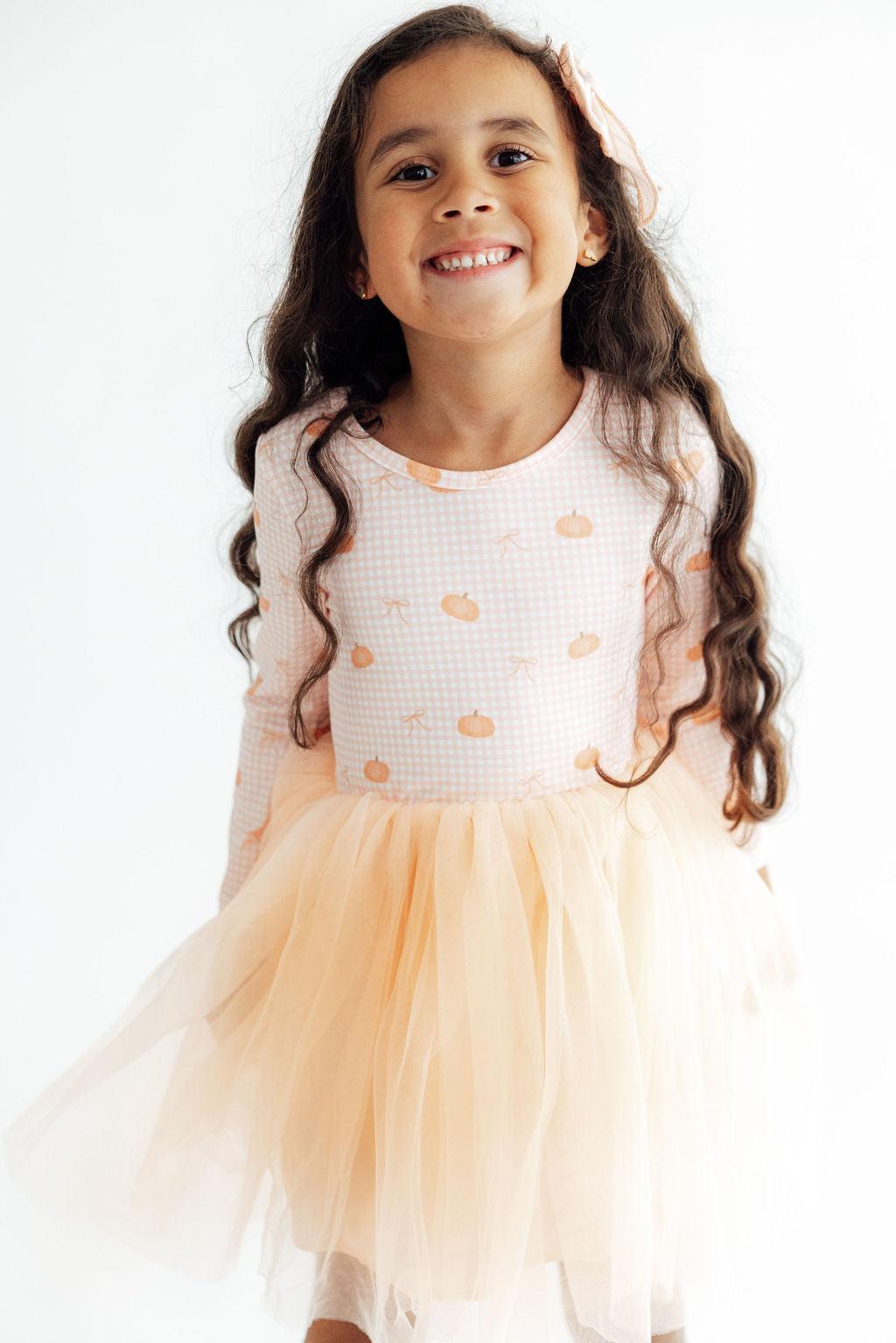 Long-sleeve tutu dress with gingham pumpkin print and a full twirly skirt