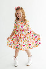 Falling Leaves twirl dress with 3/4 sleeves, pockets, and a full skirt in an autumn-leaf print
