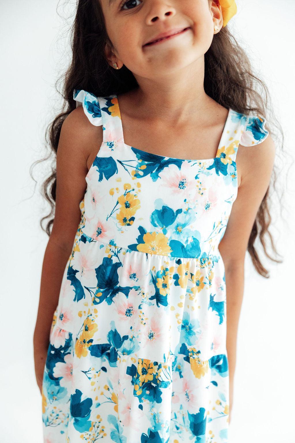 Ruffle maxi dress in a buttercup floral print with a shoulder ruffle and open back cutout