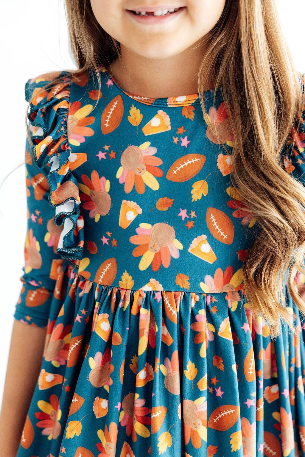 Girls' Thanksgiving turkey print ruffle twirl dress with 3/4 sleeves, ballet neckline, and full skirt