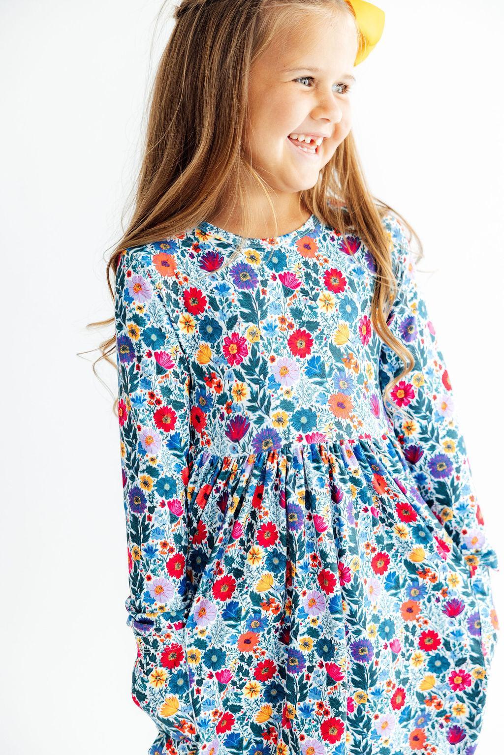 Long sleeve twirl dress in a vintage floral print with pockets and a full-circle skirt
