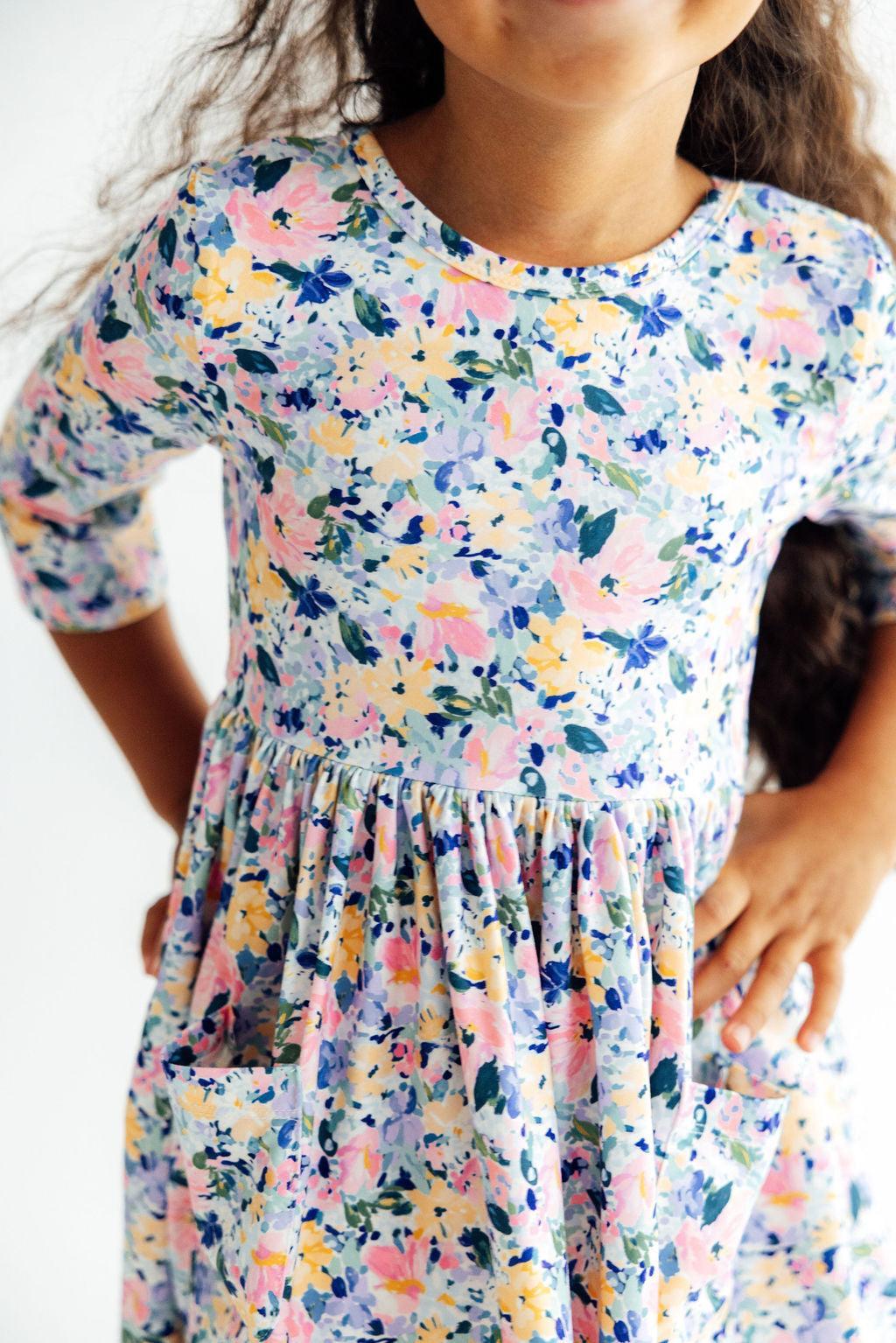 Twirl dress with fall floral print, 3/4 sleeves, ballet neckline, and full twirl skirt with pockets