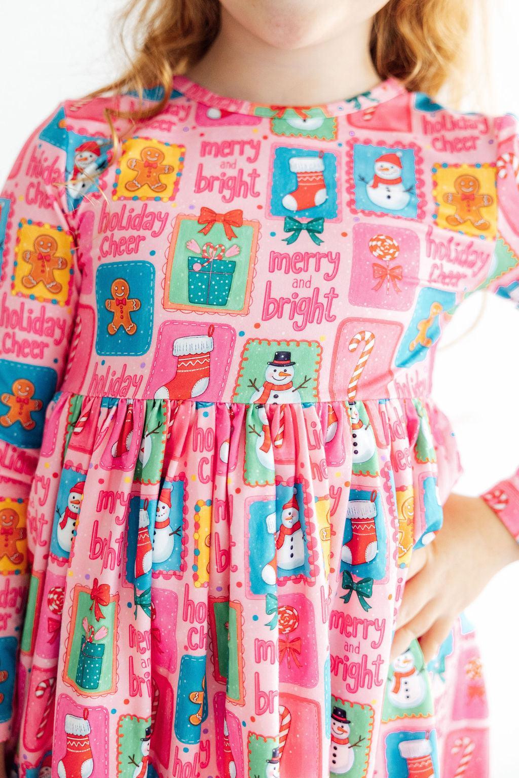Long sleeve twirl dress with holiday cheer print, ballet neckline and full ruffle hem skirt