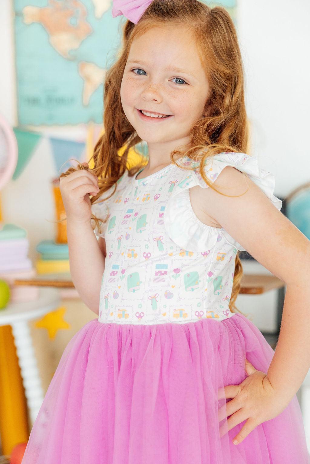 Flutter sleeve tutu dress with a full skirt in the Little Learner style