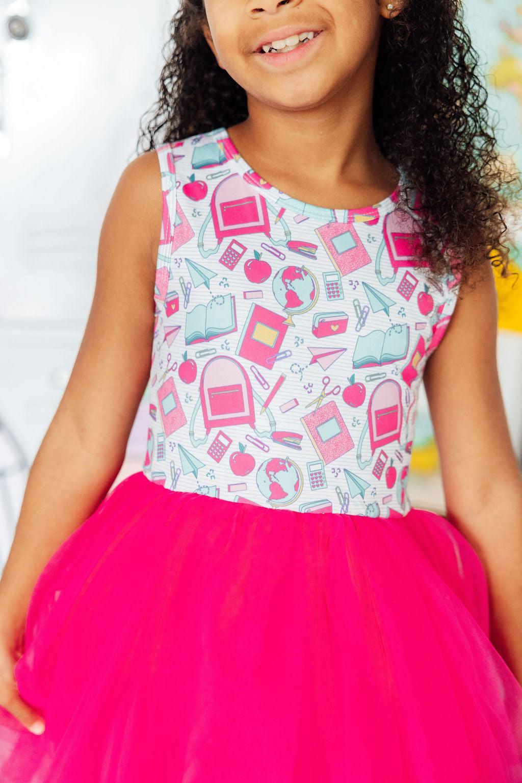 Sleeveless tutu dress with a fitted tank bodice and full soft tulle skirt.