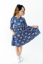Girls' plaid twirl dress with 3/4 sleeves and built-in pockets