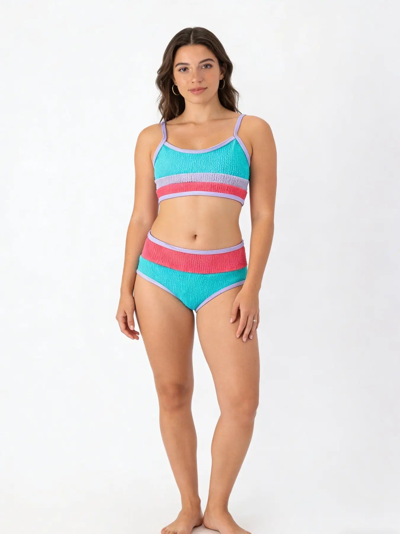 Women's swimsuit with bold blue and red vertical stripes.