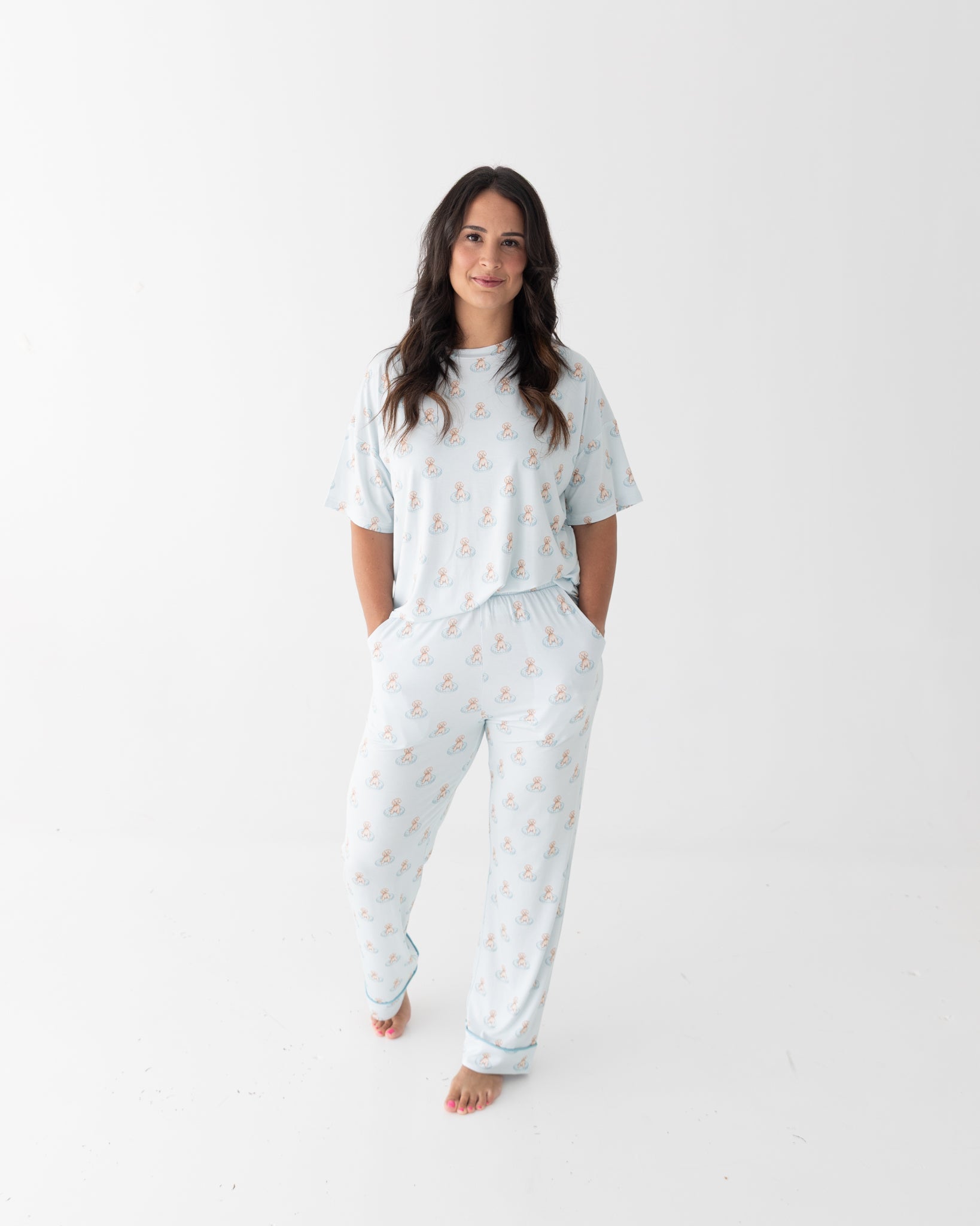 Women's lounge set with short sleeve top and pants in a blue puppy pool party print with splashing dogs.