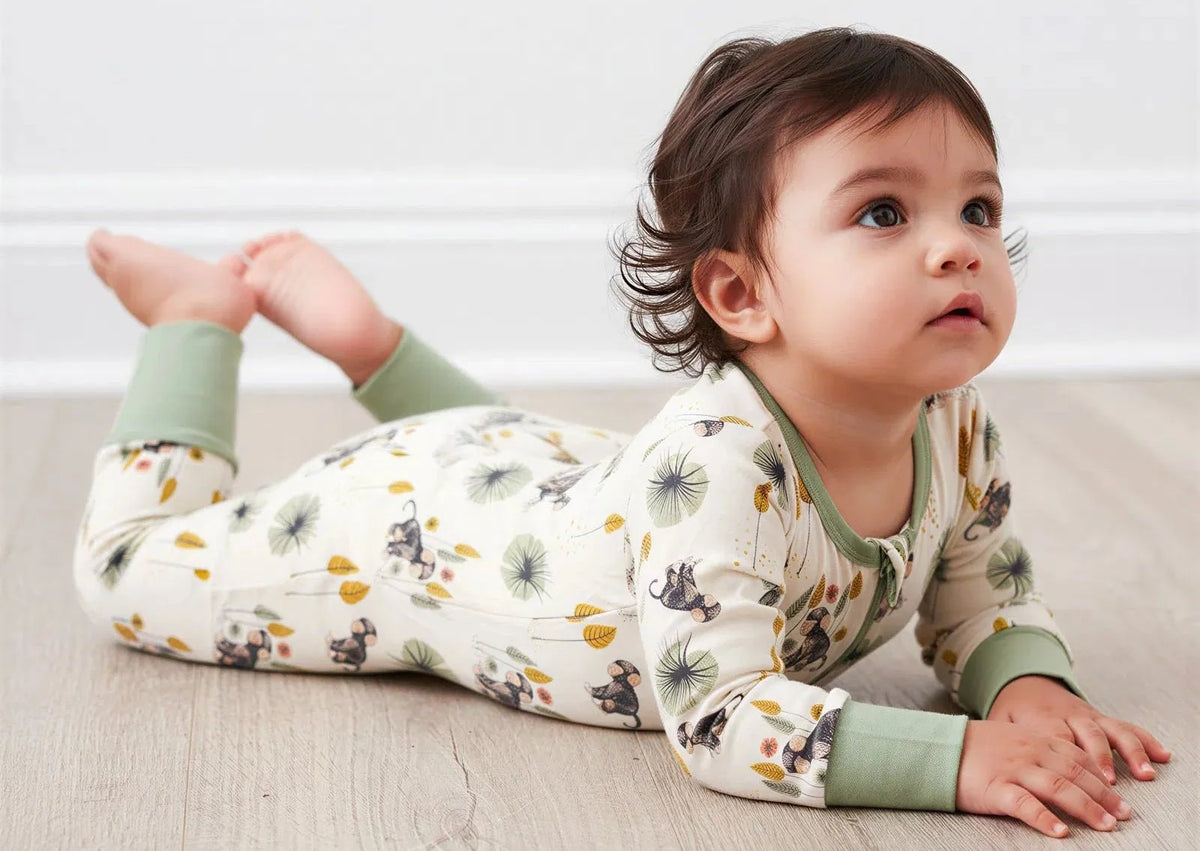 Baby convertible coverall with monkey print and two-way front zipper, shown with footed cuffs