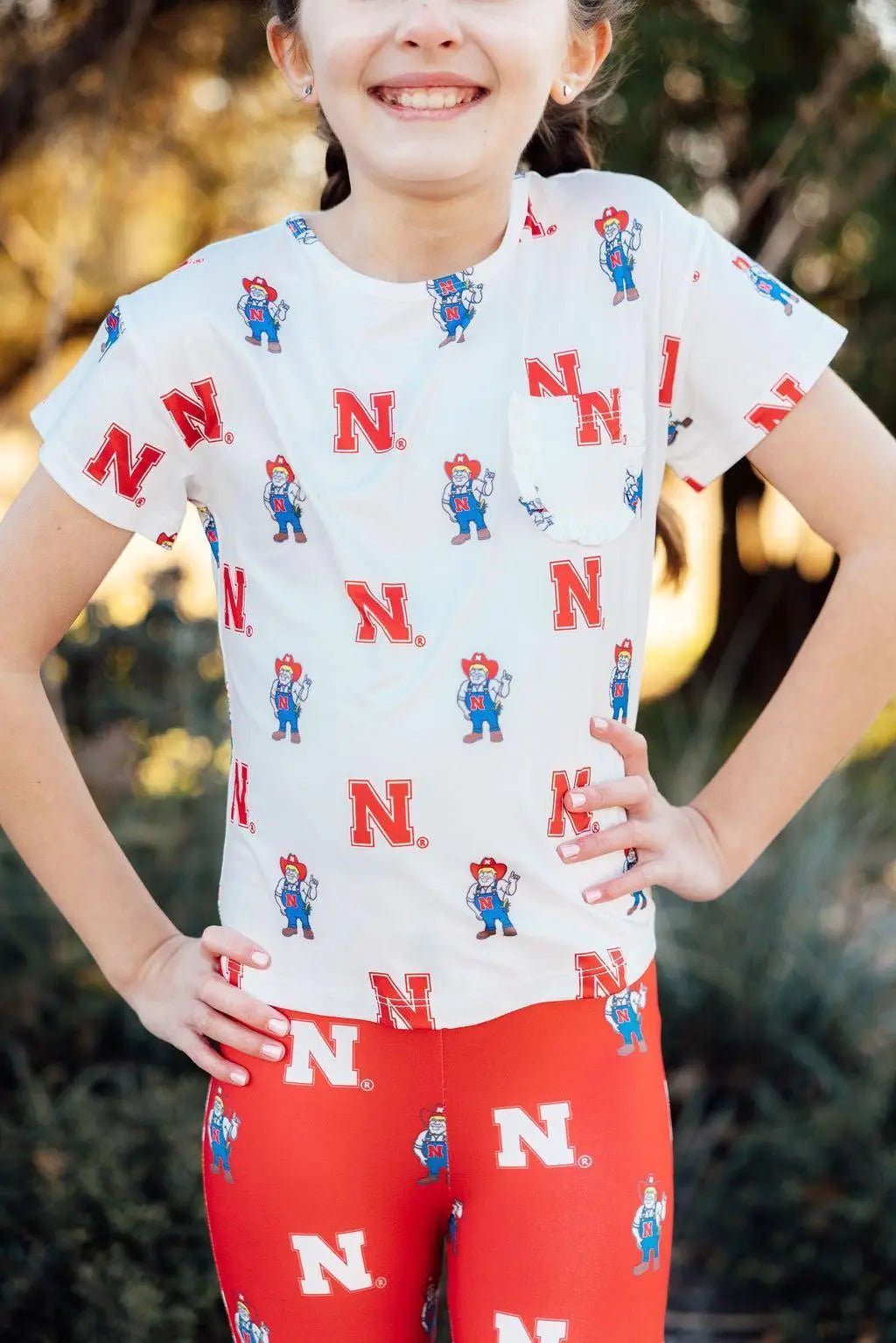 Mila & Rose ® Nebraska White Herbie Husker Ruffle Pocket Tee - 