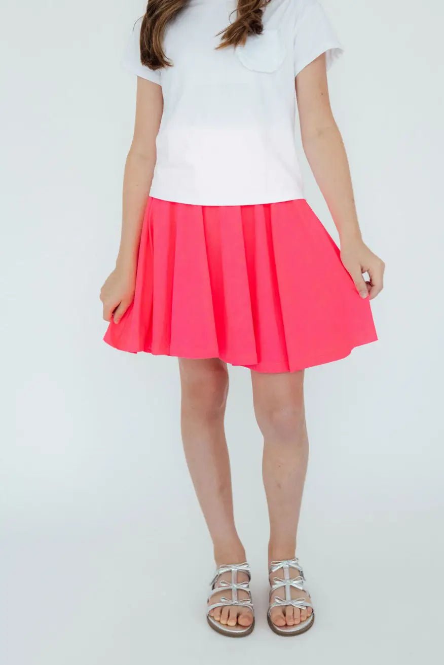 Neon pink twirl skort with a flowy A-line skirt and hidden attached shorts underneath