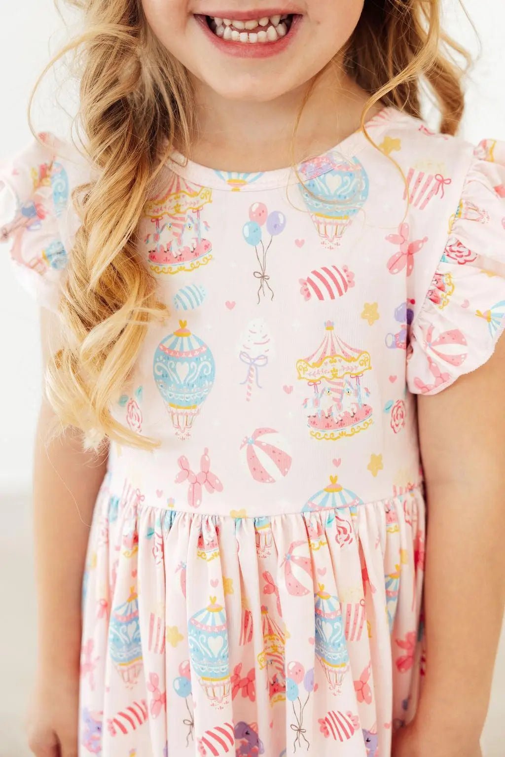 Circus-print girls' twirl dress with flutter sleeves and a full skirt
