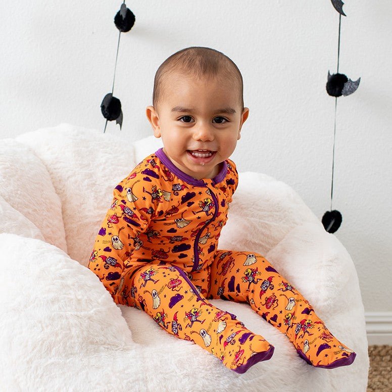 Orange baby footie pajamas with two-way zipper and footed legs