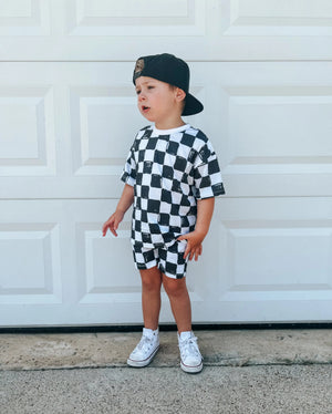 Black and white checkered shorts set for a toddler, made of organic cotton