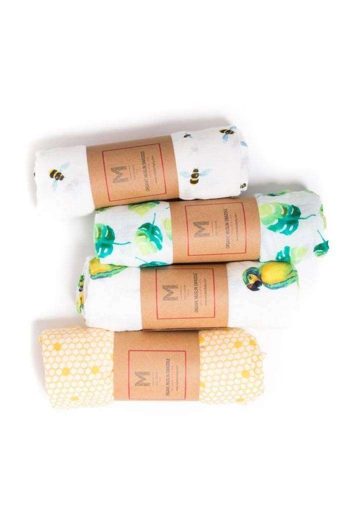 Four organic cotton muslin baby swaddle blankets with watercolor prints.